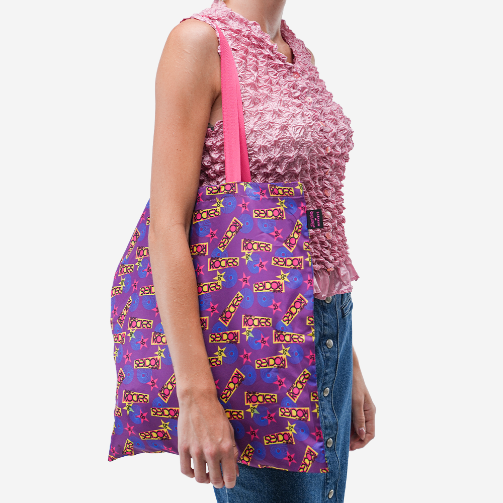 The Barbie And The Rockers Shopper Tote being worn by a model