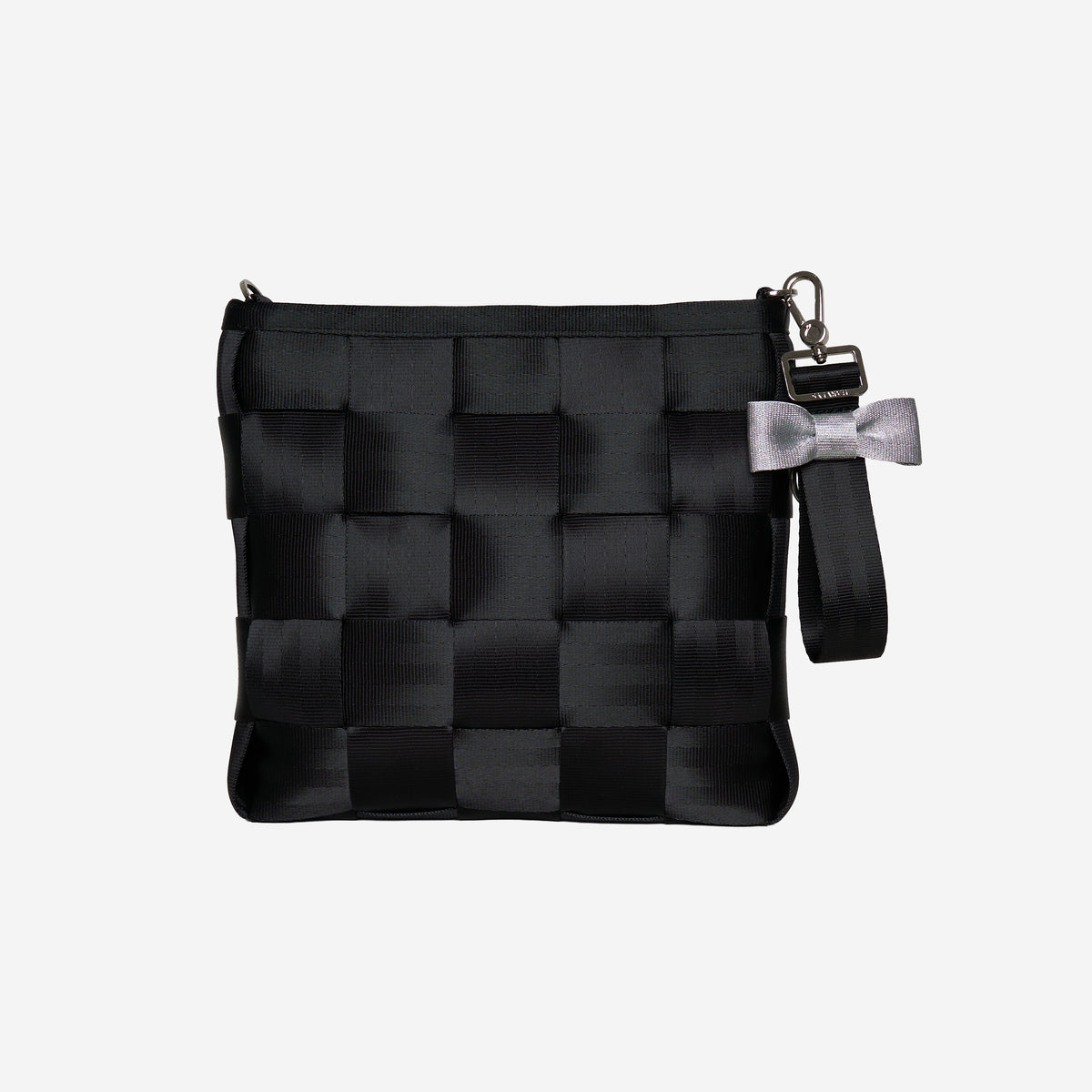 The Black and Silver Bow Keychain on a bag