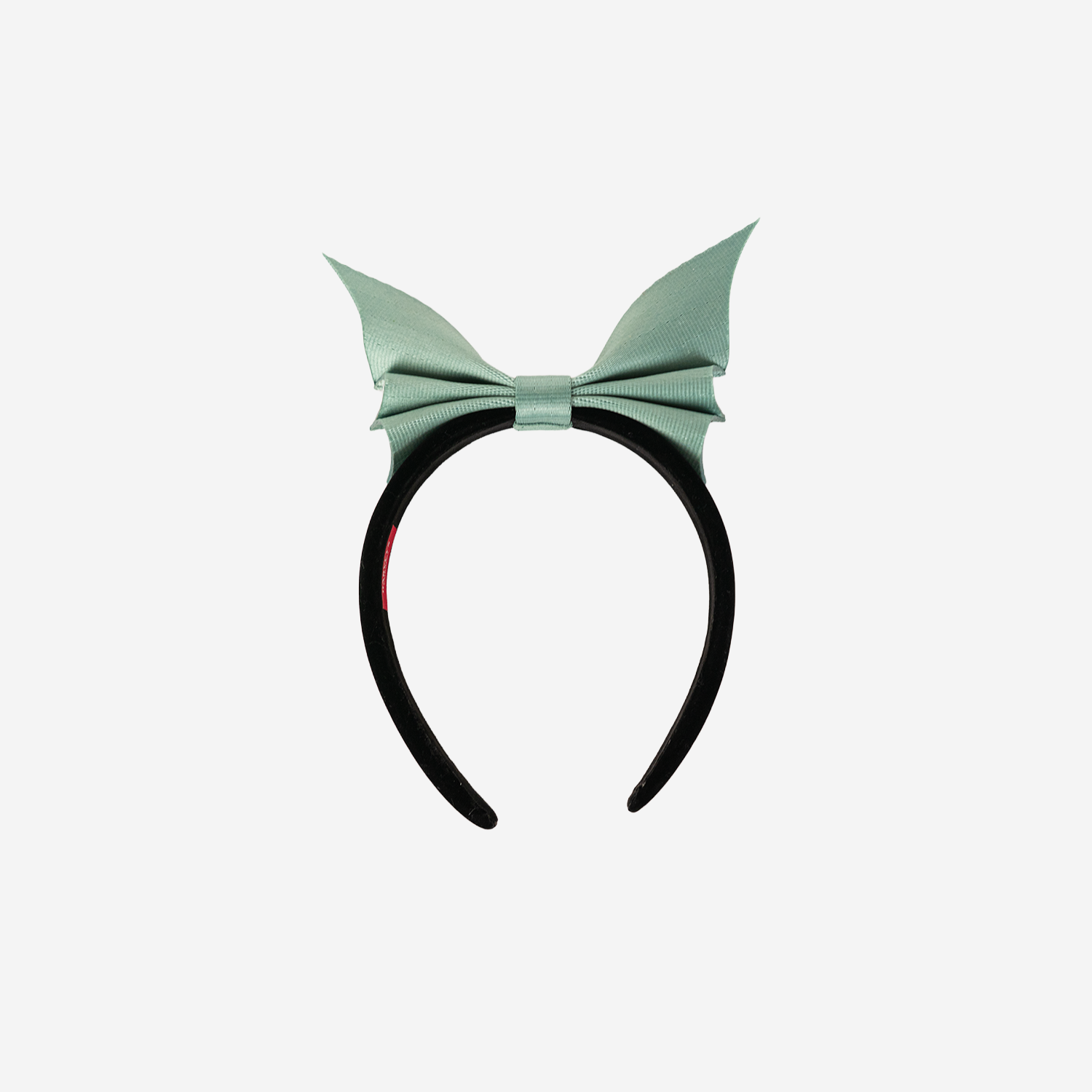 Front view of a Bat Headband in Mint