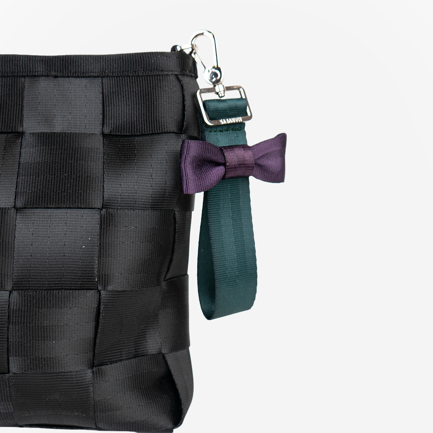The Bow Keychain in Poison Ivy being used on a bag