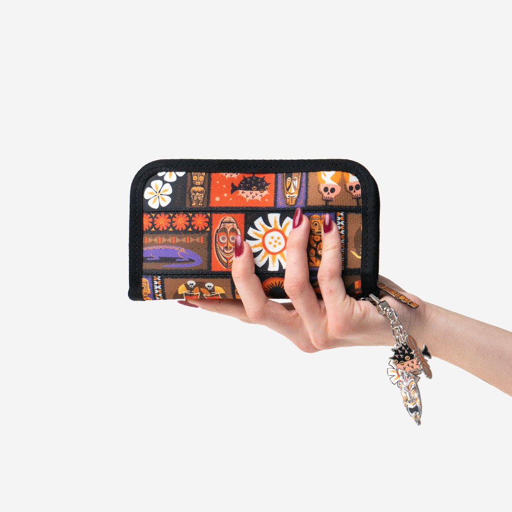 The Shag Tiki Tapa Classic Wallet being Held by a model