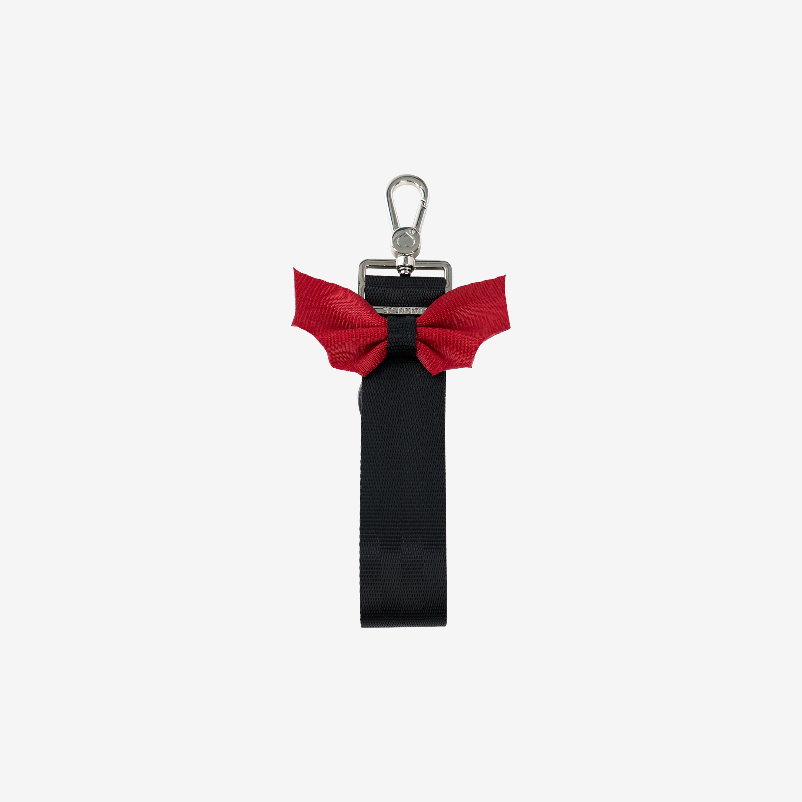 Front view of black keychain with red bat shaped bow