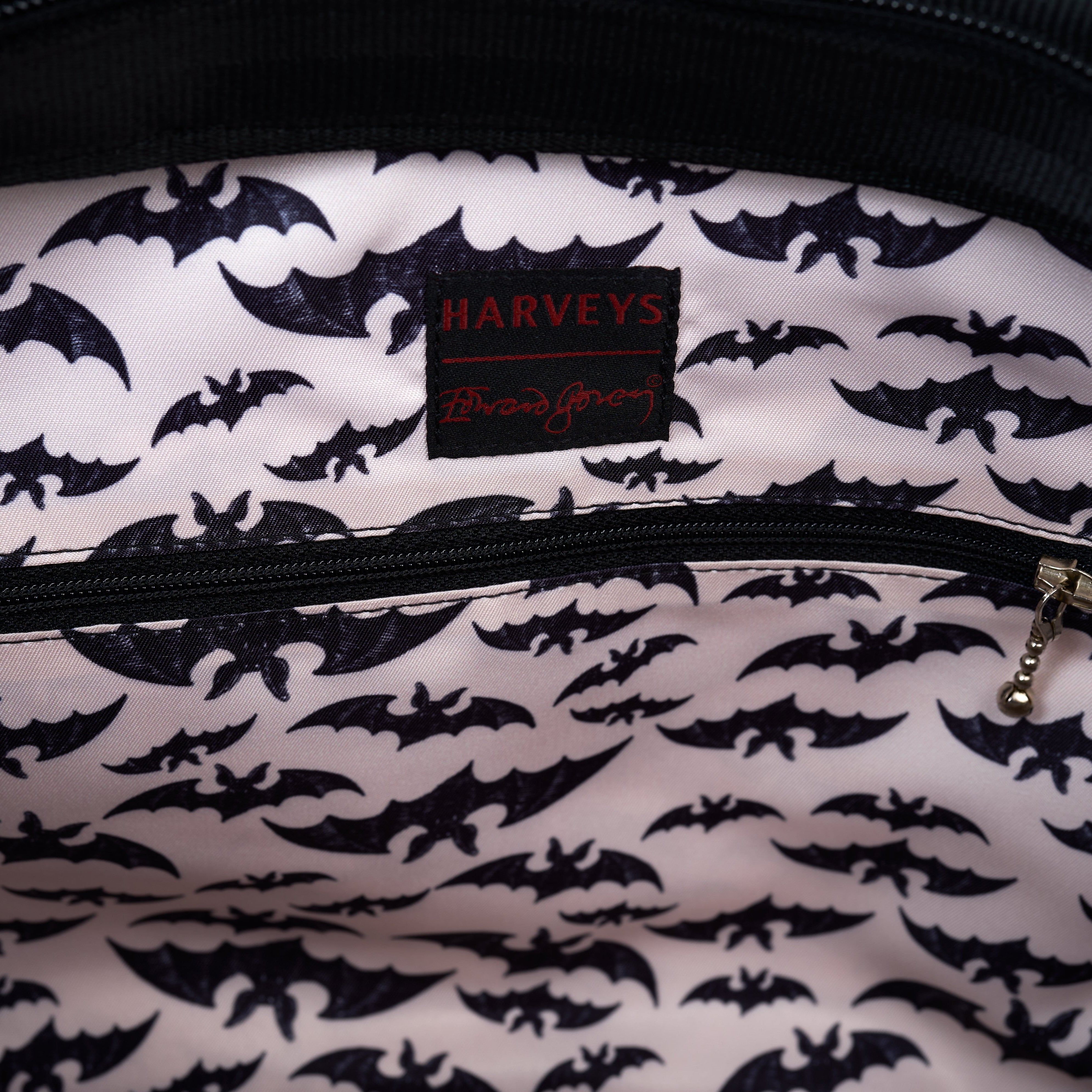 inside of large bat tote showing bat lining and zippered inside pocket