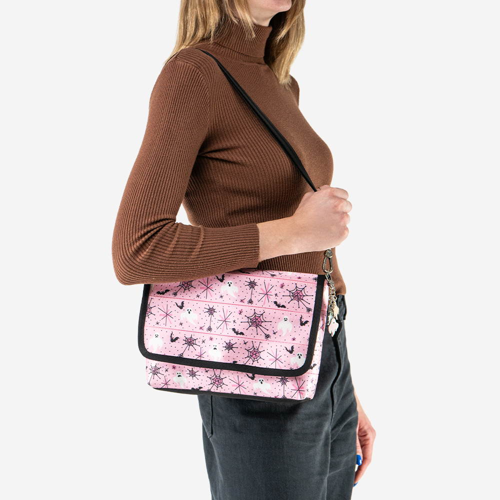 A Pink-A-Boo Medium Foldover Crossbody being worn by a model.