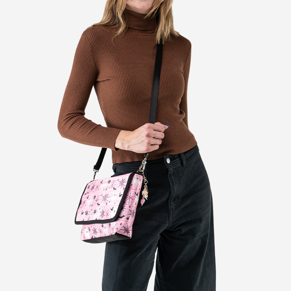 A Pink-A-Boo Medium Foldover Crossbody being worn by a model.