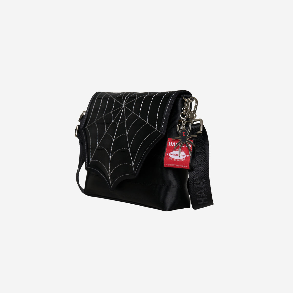The side view of The Black Widow Medium Foldover Crossbody Collector's Series
