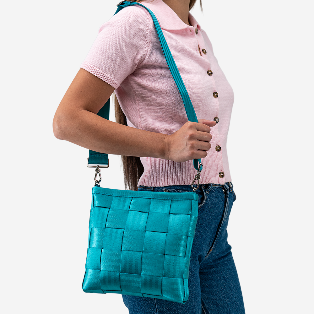 The Mini Messenger in Aqua being worn by a model