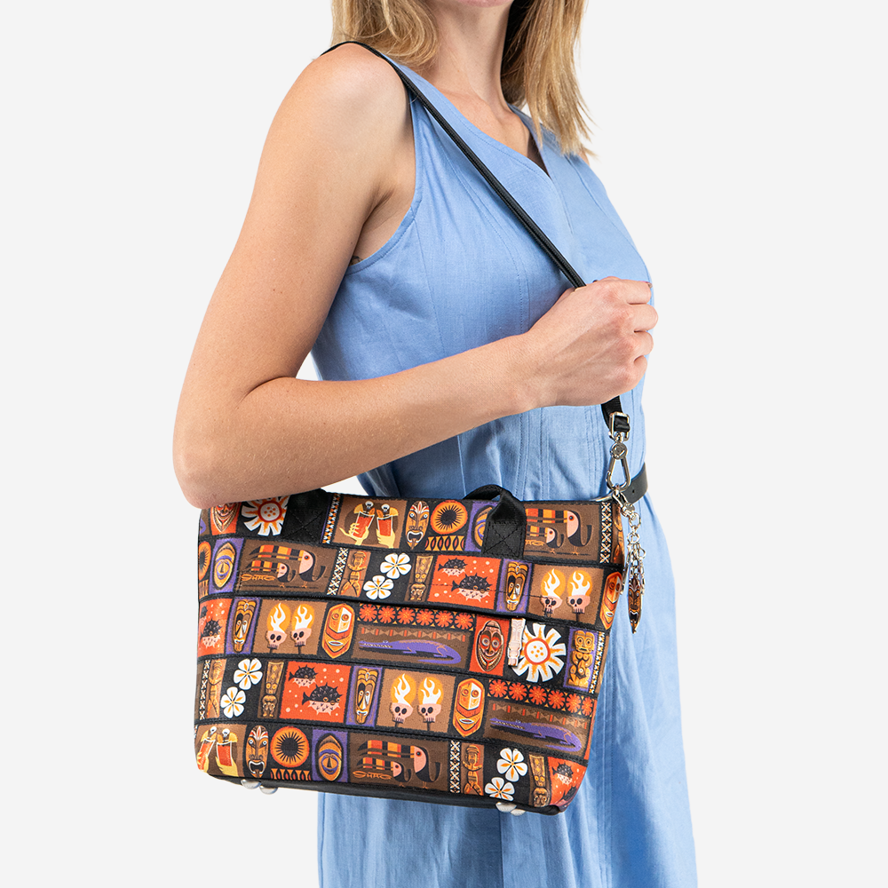 The Shag Tiki Tapa Mini Streamline Tote being worn by a model
