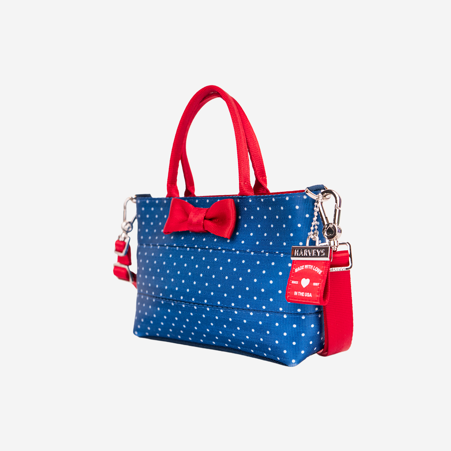 The side view of a Scarlet and Blue Dottie Petite Tote