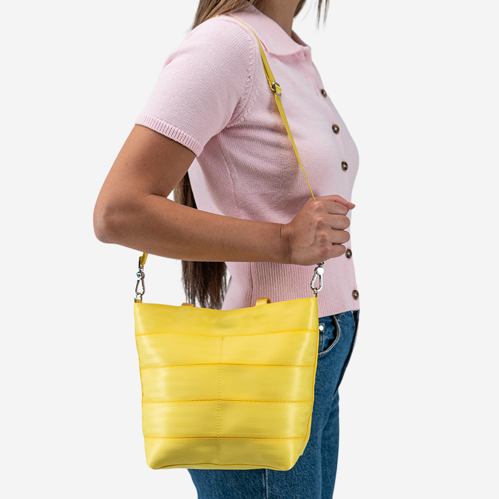 The Rosie Tote in Lemon being worn by a model