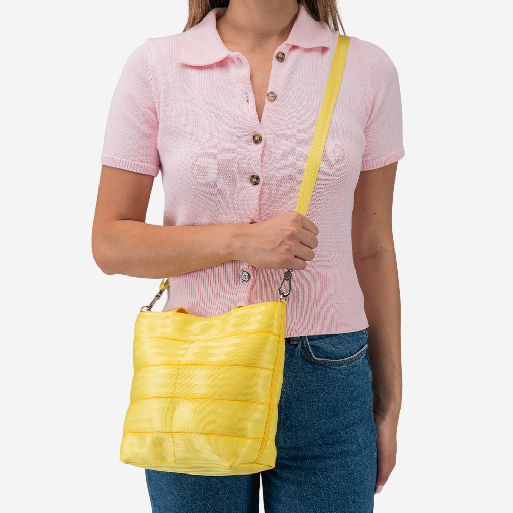 The Rosie Tote in Lemon being worn by a model