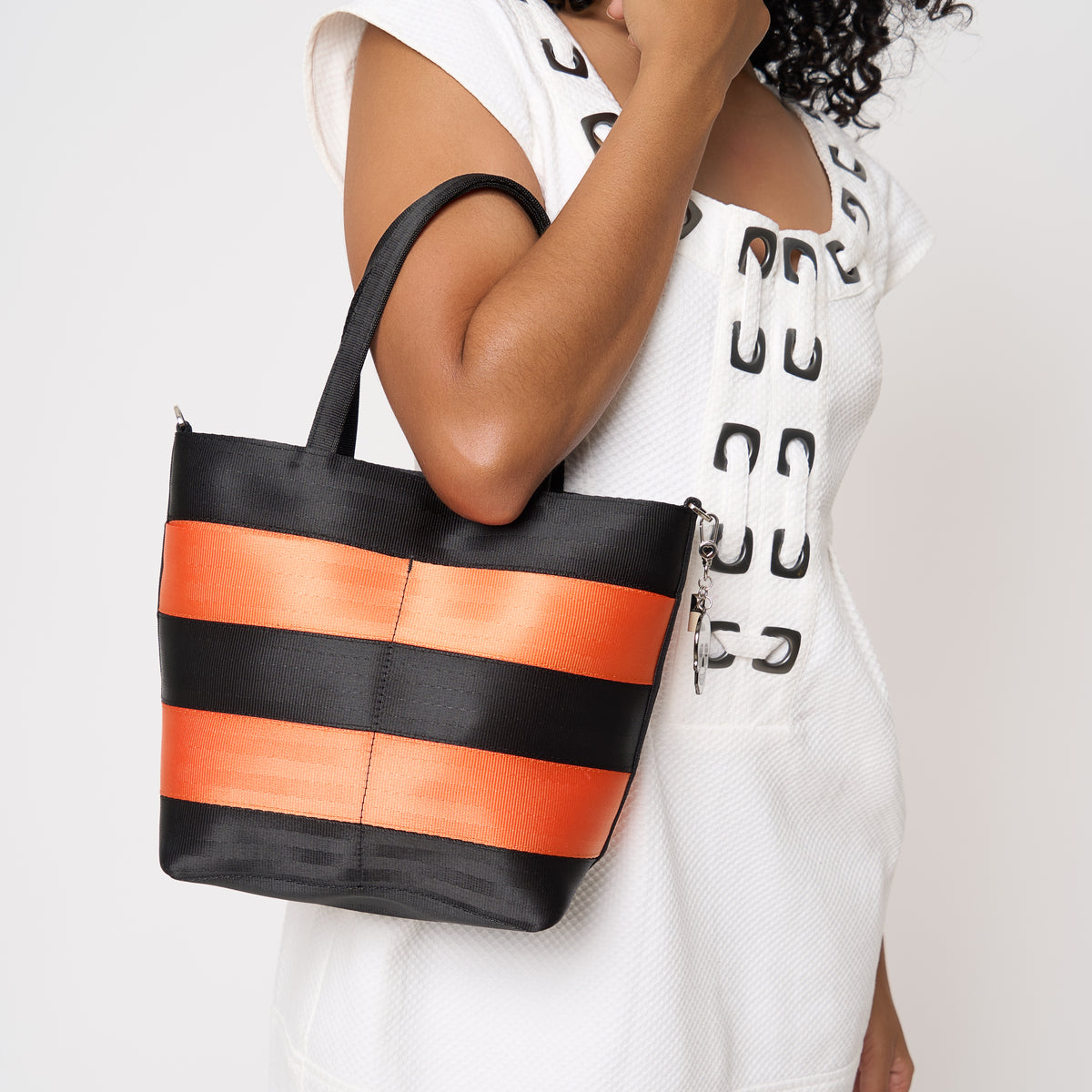 Model carrying Rosie tote in Jack O'Lantern