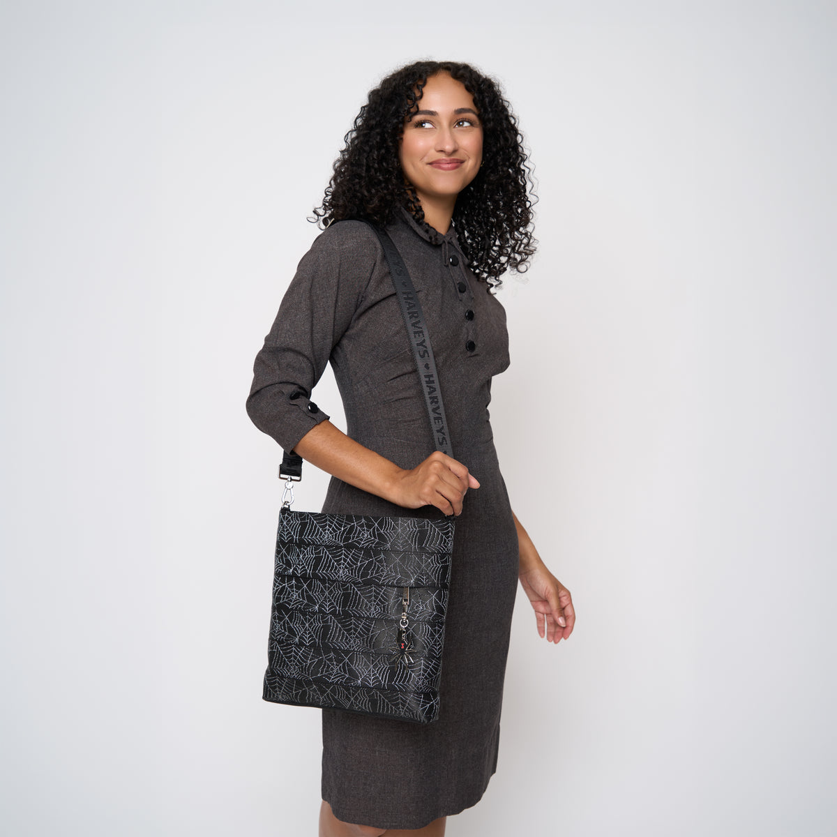 A model wearing a Black Widow Streamline Crossbody