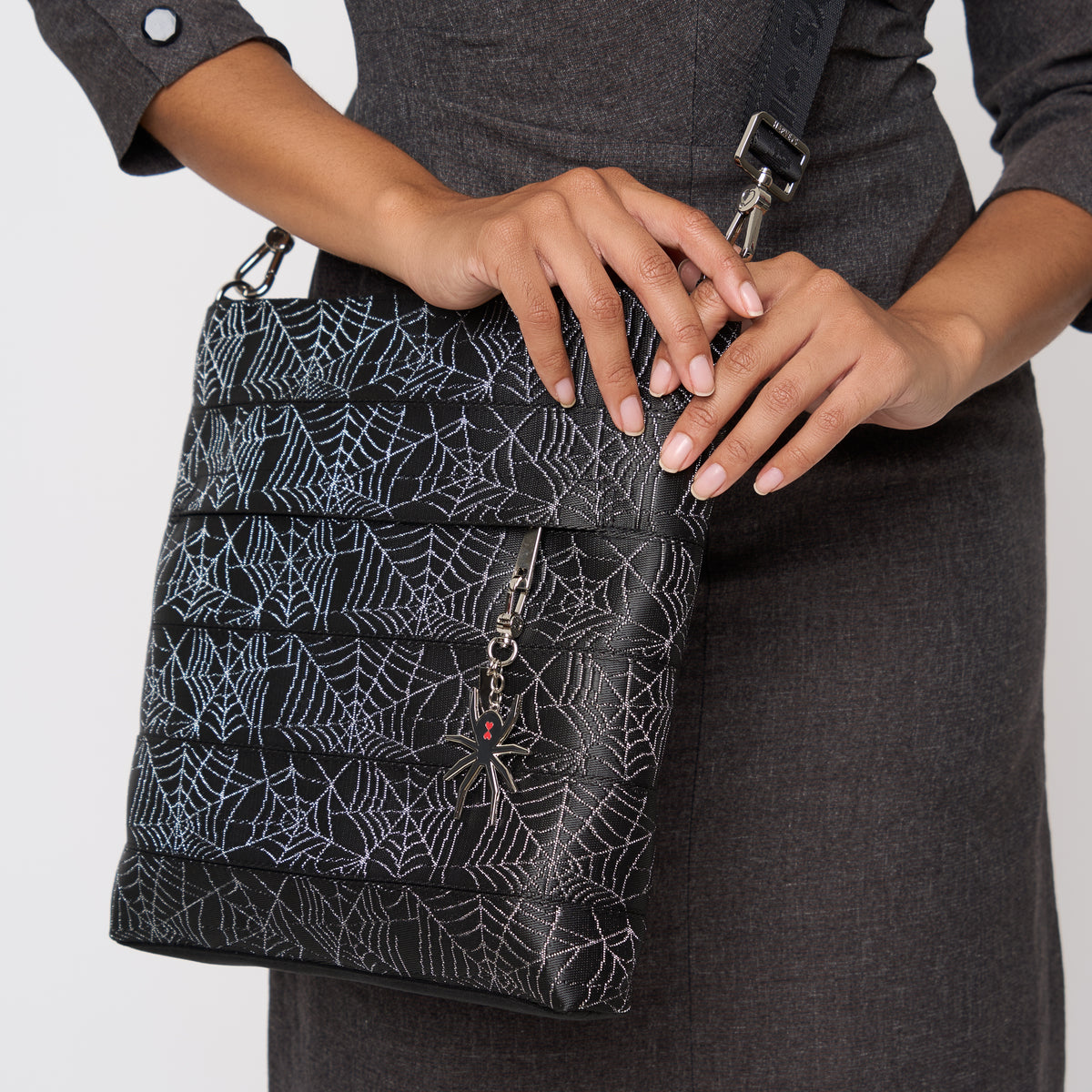 A model wearing a Black Widow Streamline Crossbody