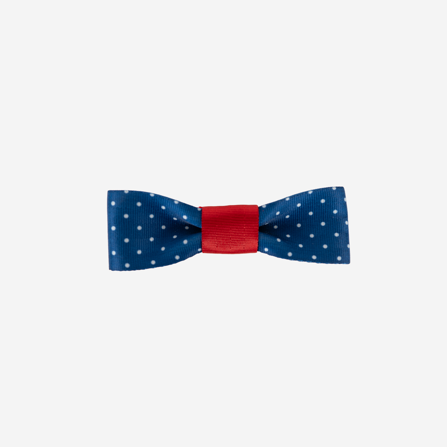 The front view of a Seatbelt Bow in Scarlet and Blue Dottie