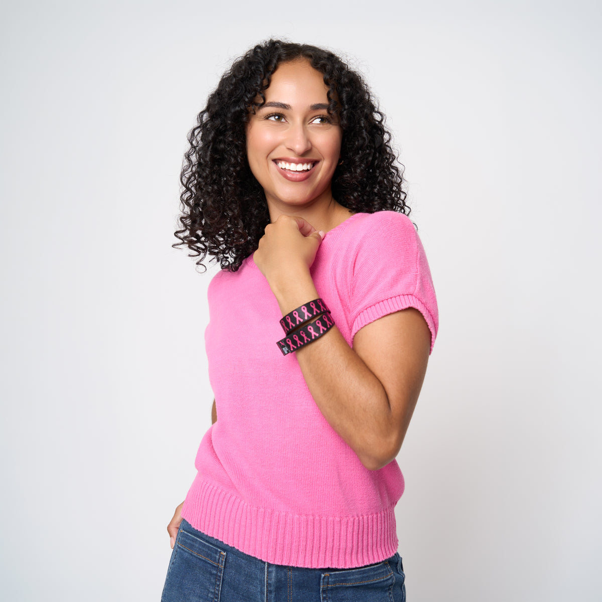 A model wearing The Pink Agenda Pink Ribbon Tuff Cuff