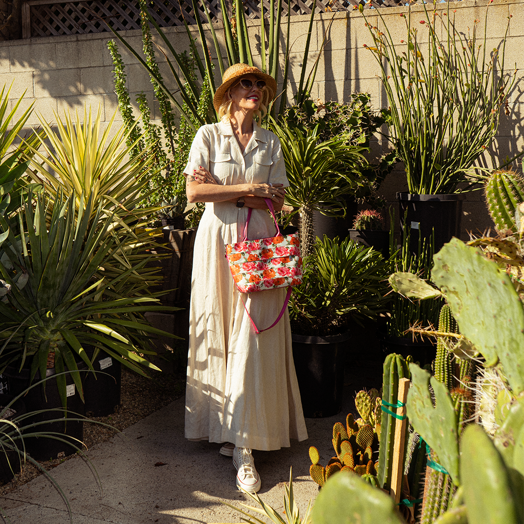 The Betty Rose Mini Streamline Tote being worn by a model