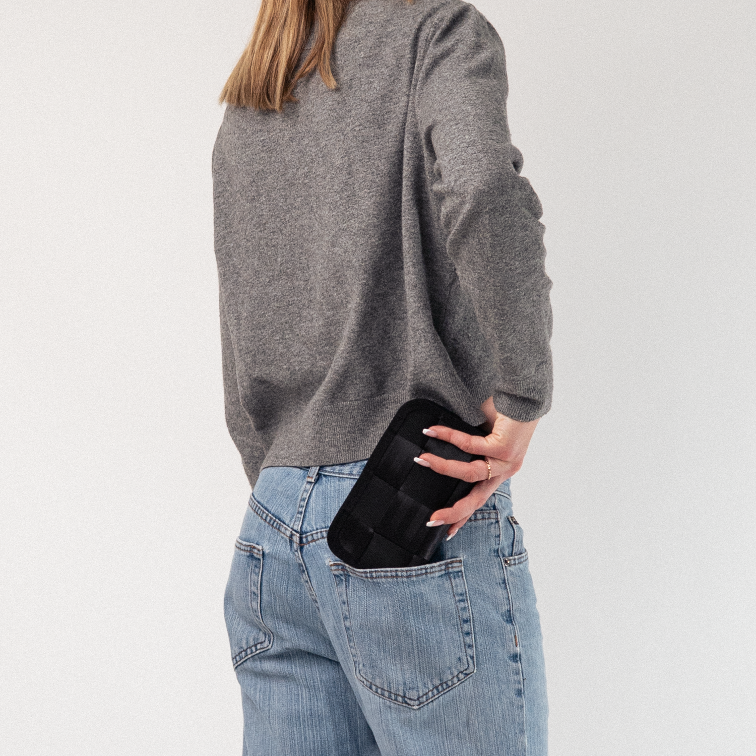 A Classic Wallet in Black being held by a model