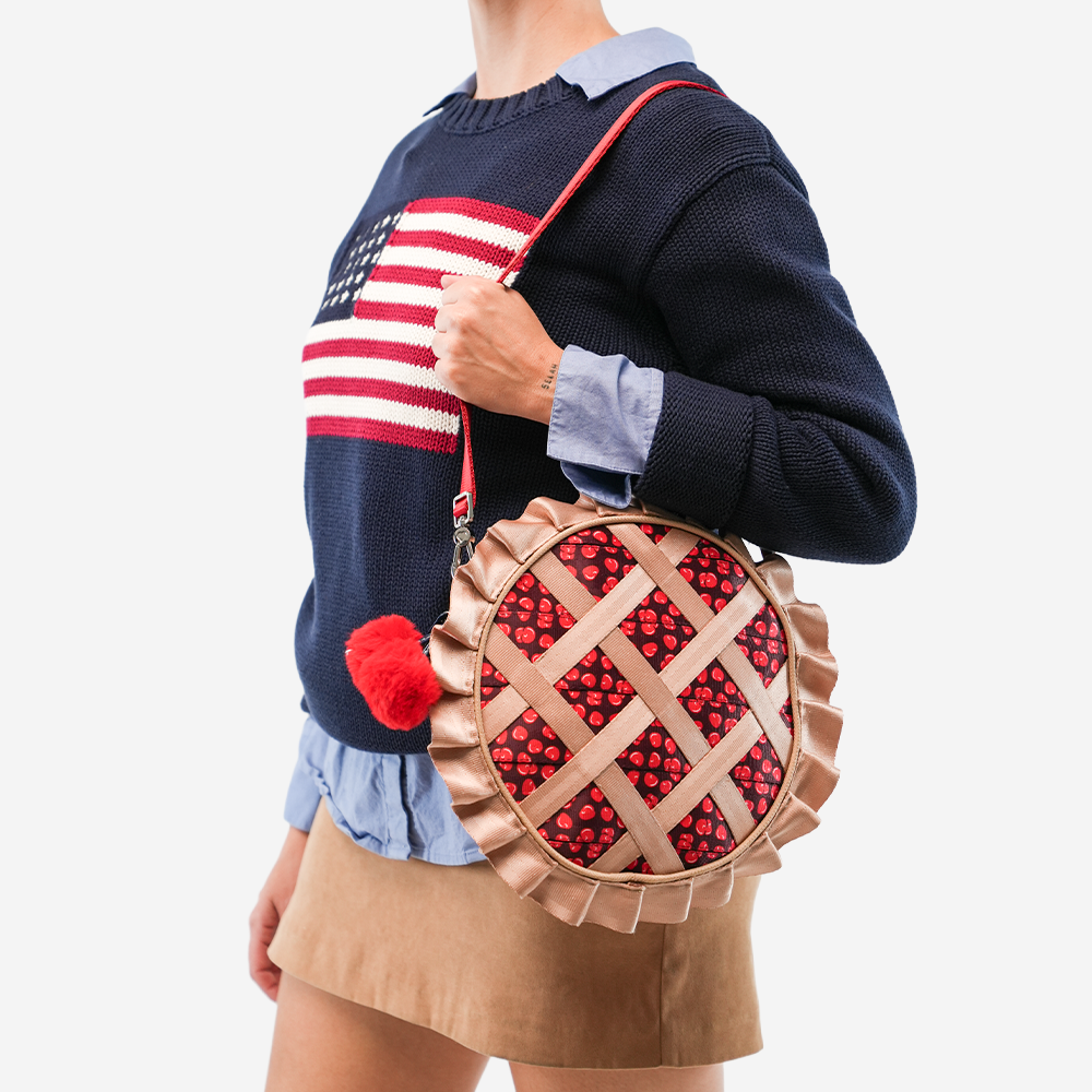 The Cherry Pie Circle Crossbody being worn by a model
