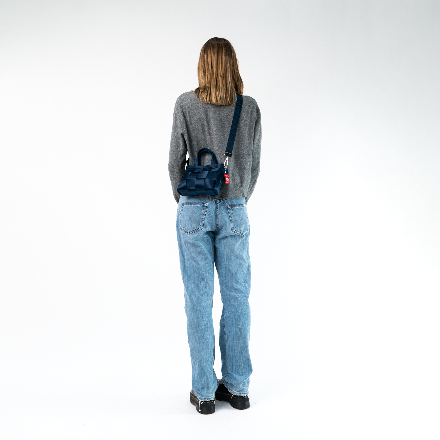 A Woven Petite Tote in Indigo being worn by a Model