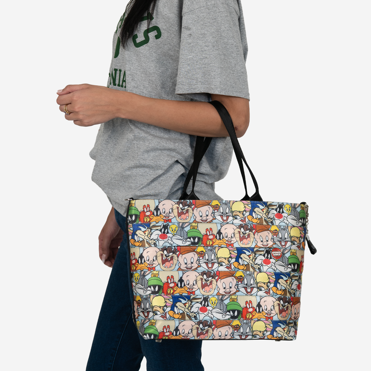 looney tunes medium streamline tote being worn on a model