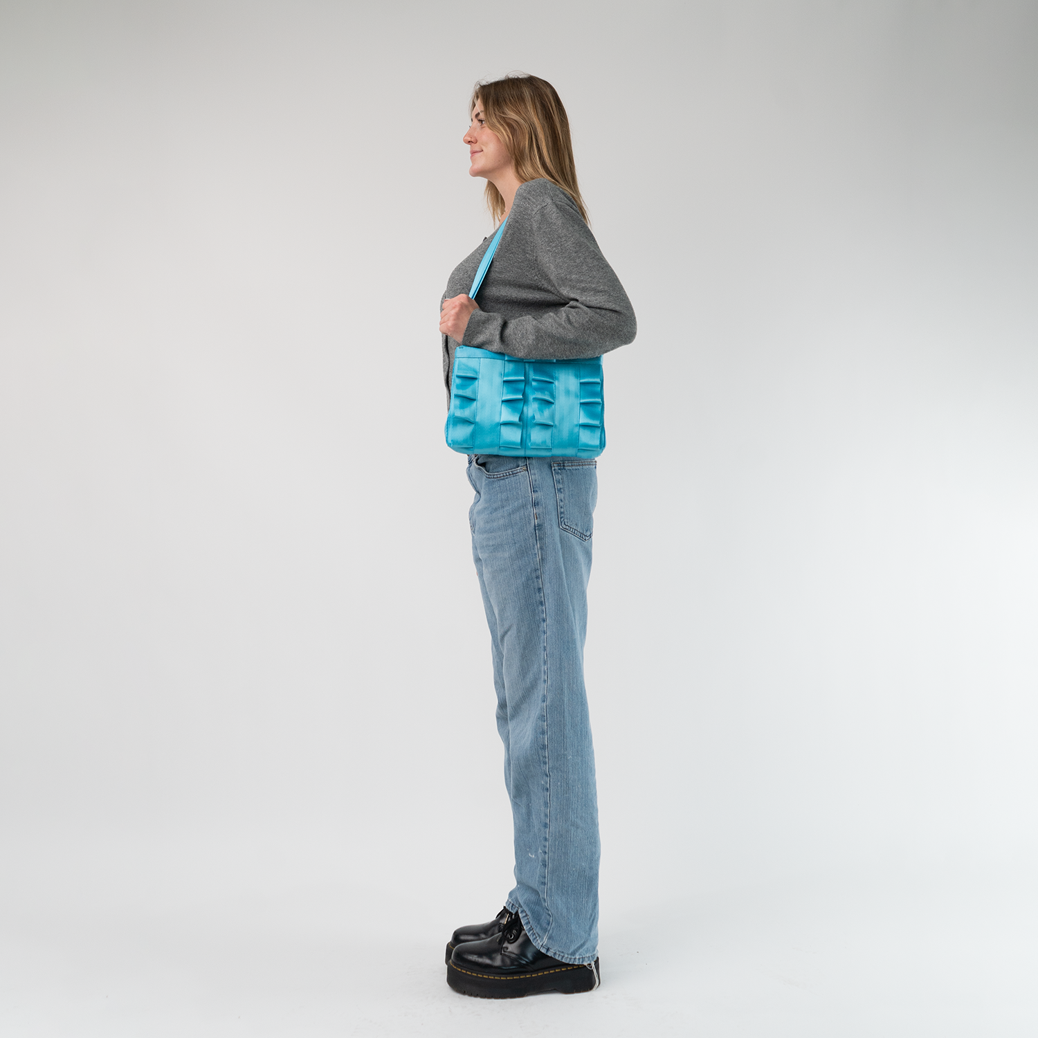 The Maliblue Lola Bow Clutch being worn by a model