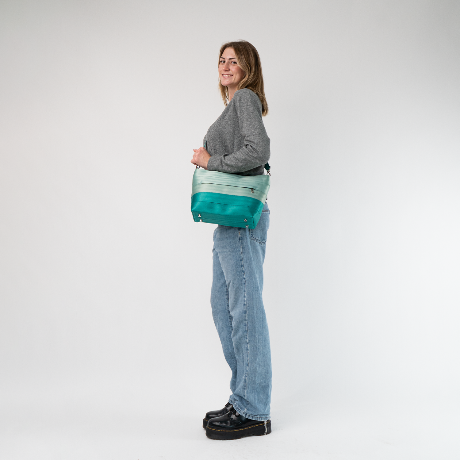 The Mint N Emerald Mini Streamline Tote being worn by a model