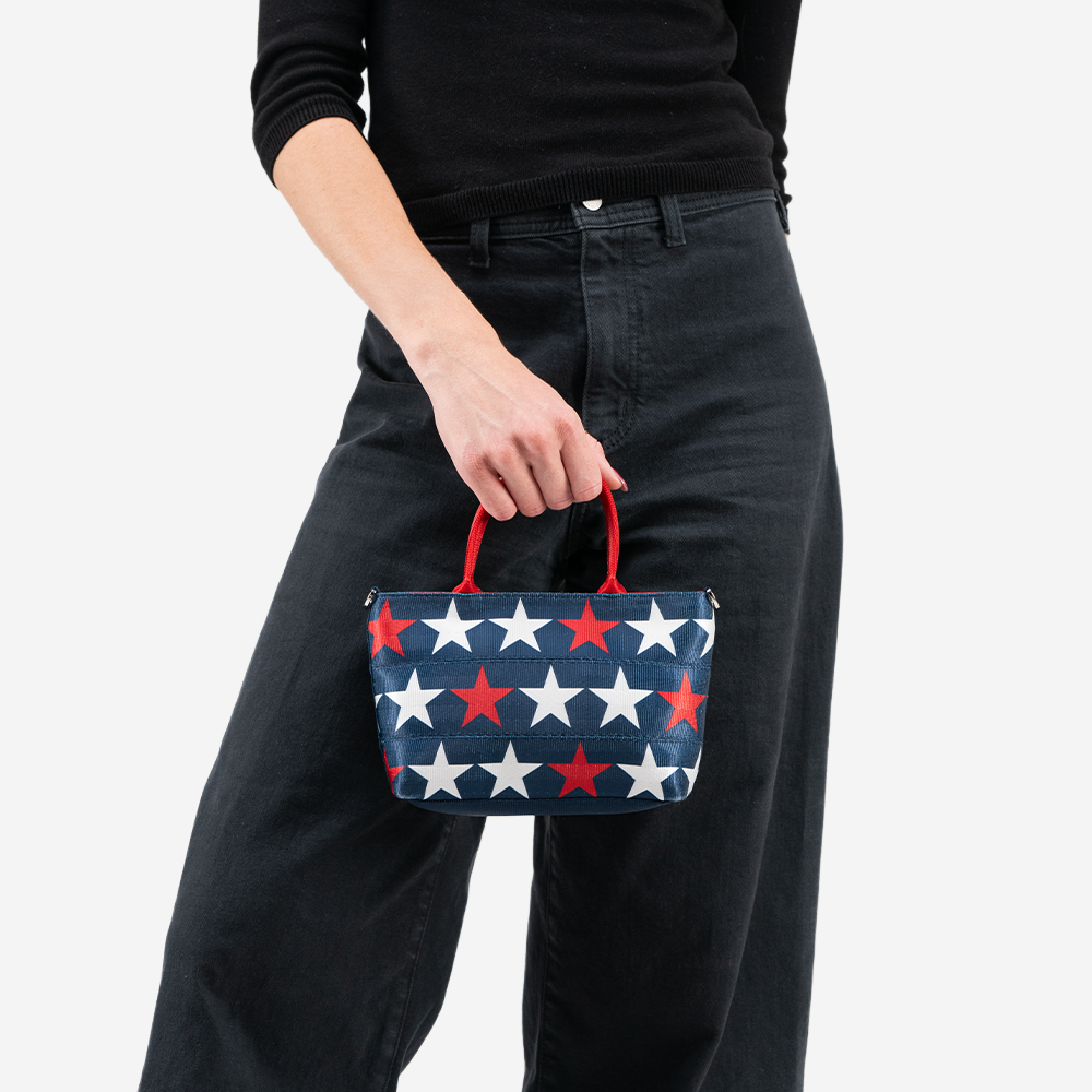 The RWB Stars Petite Tote being held by a model