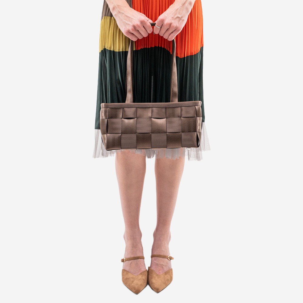 The Satchel in Espresso being worn by a model