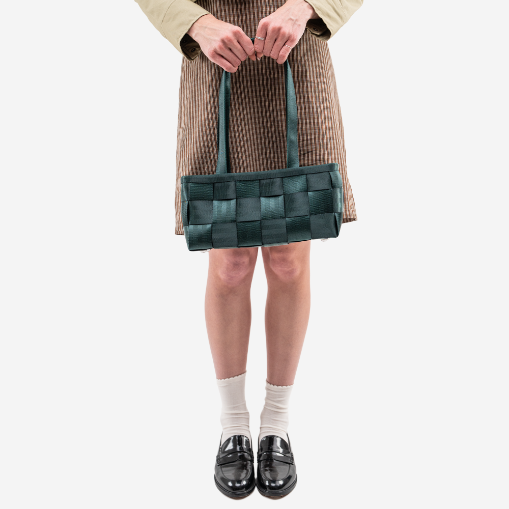 The Satchel in Nori being worn by a model