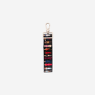 The back view of the Barbie Through The Eras 4 Panel Keychain