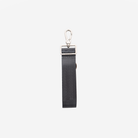 A gray seatbelt strap with a silver metal carabiner clip and a silver rectangular buckle, shown against a plain light gray background.