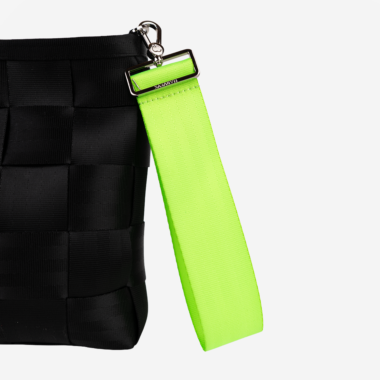 The 5 Panel Keychain in Lime being used on a bag