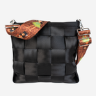 The Shag Hula Girl 5 Panel Click N Carry being used on a bag