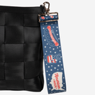 The American Made 5 Panel Keychain being used on a bag