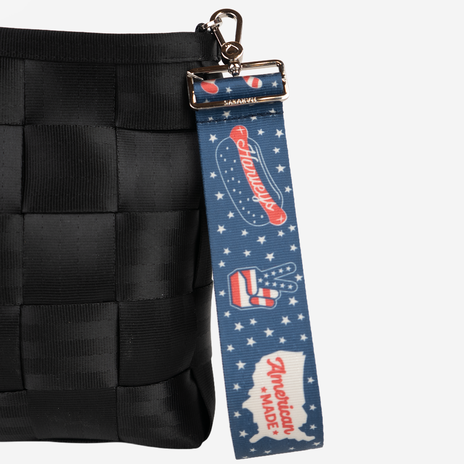 The American Made 5 Panel Keychain being used on a bag