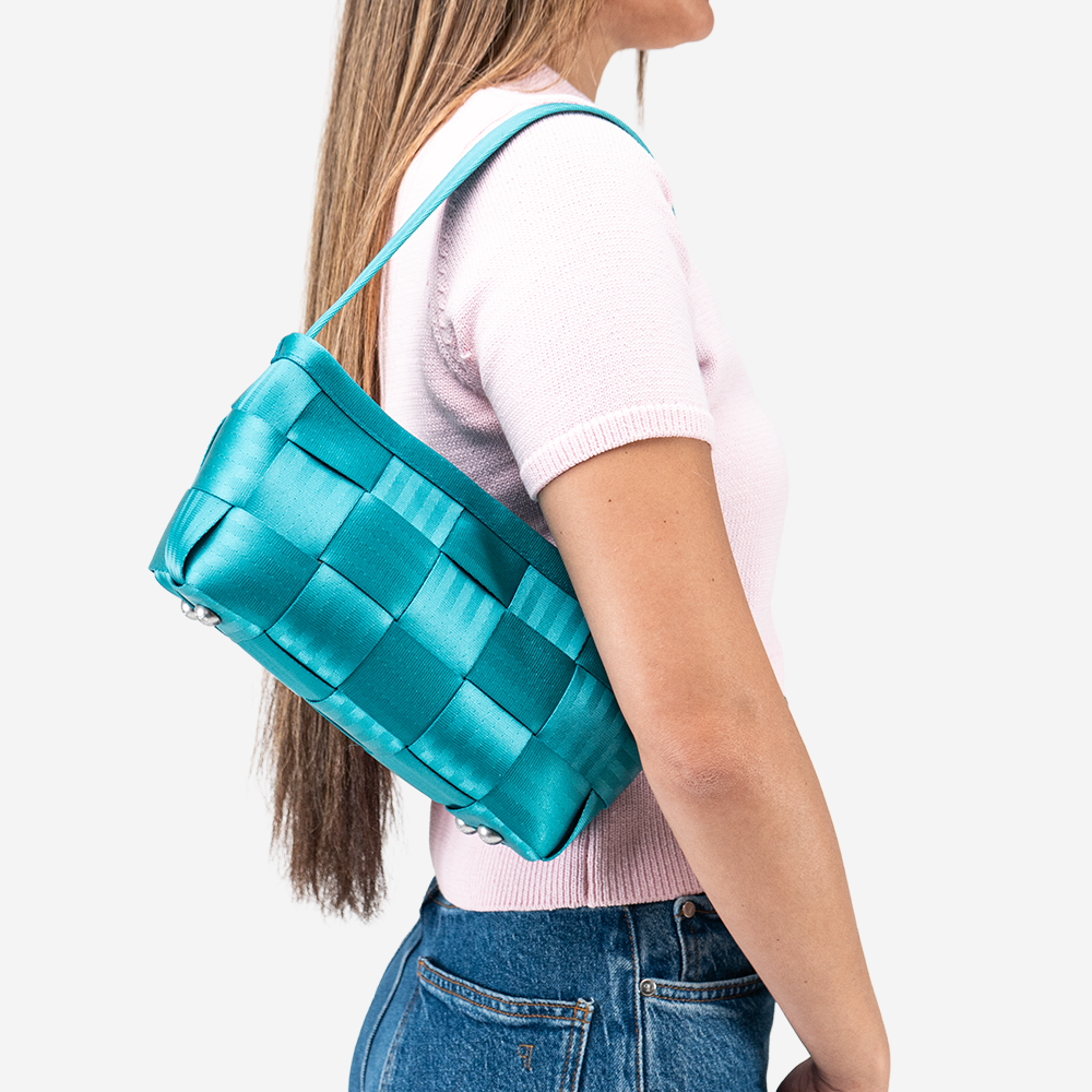 The Baguette in Aqua being worn by a model