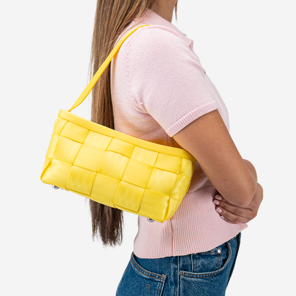 The Baguette in Lemon being worn by a model