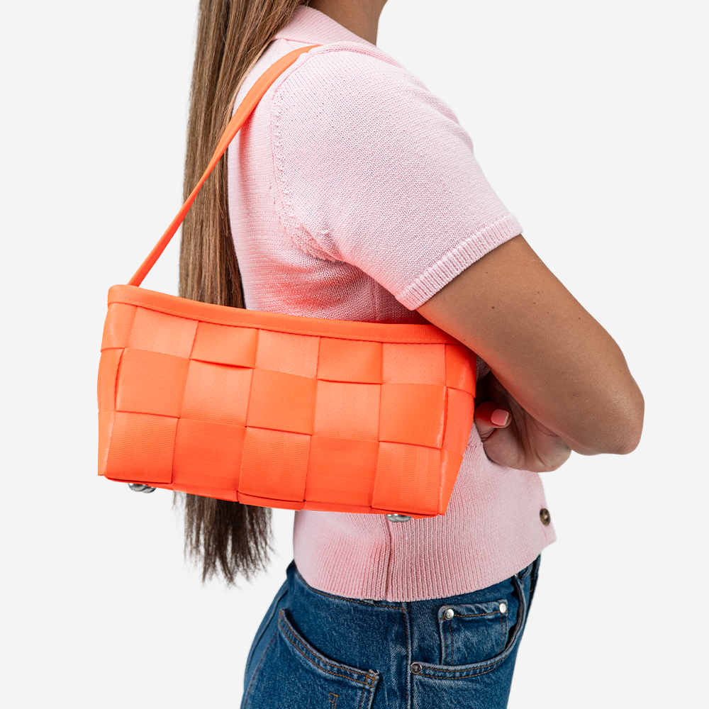 The Baguette in Poppy being worn by a model