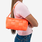The Baguette in Poppy being worn by a model