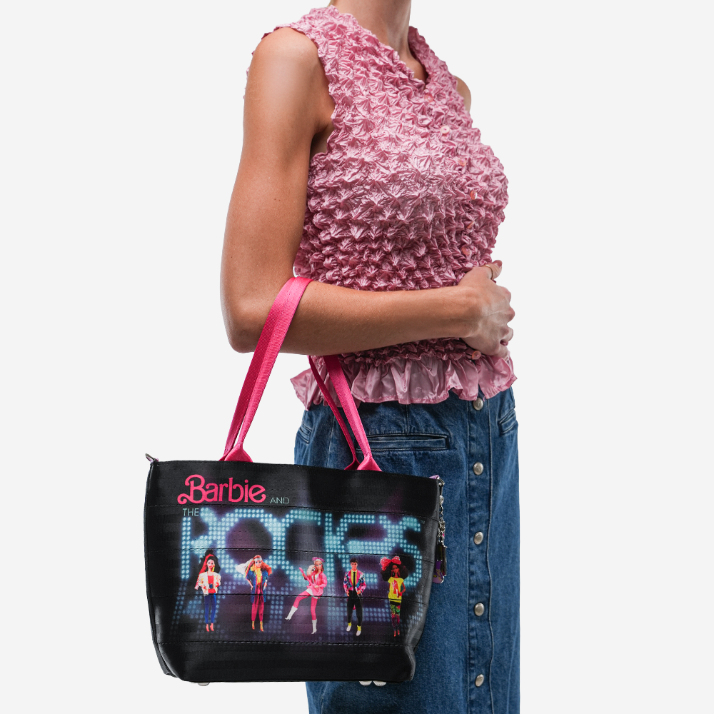 The Barbie And The Rockers Mini Streamline Tote being worn by a model