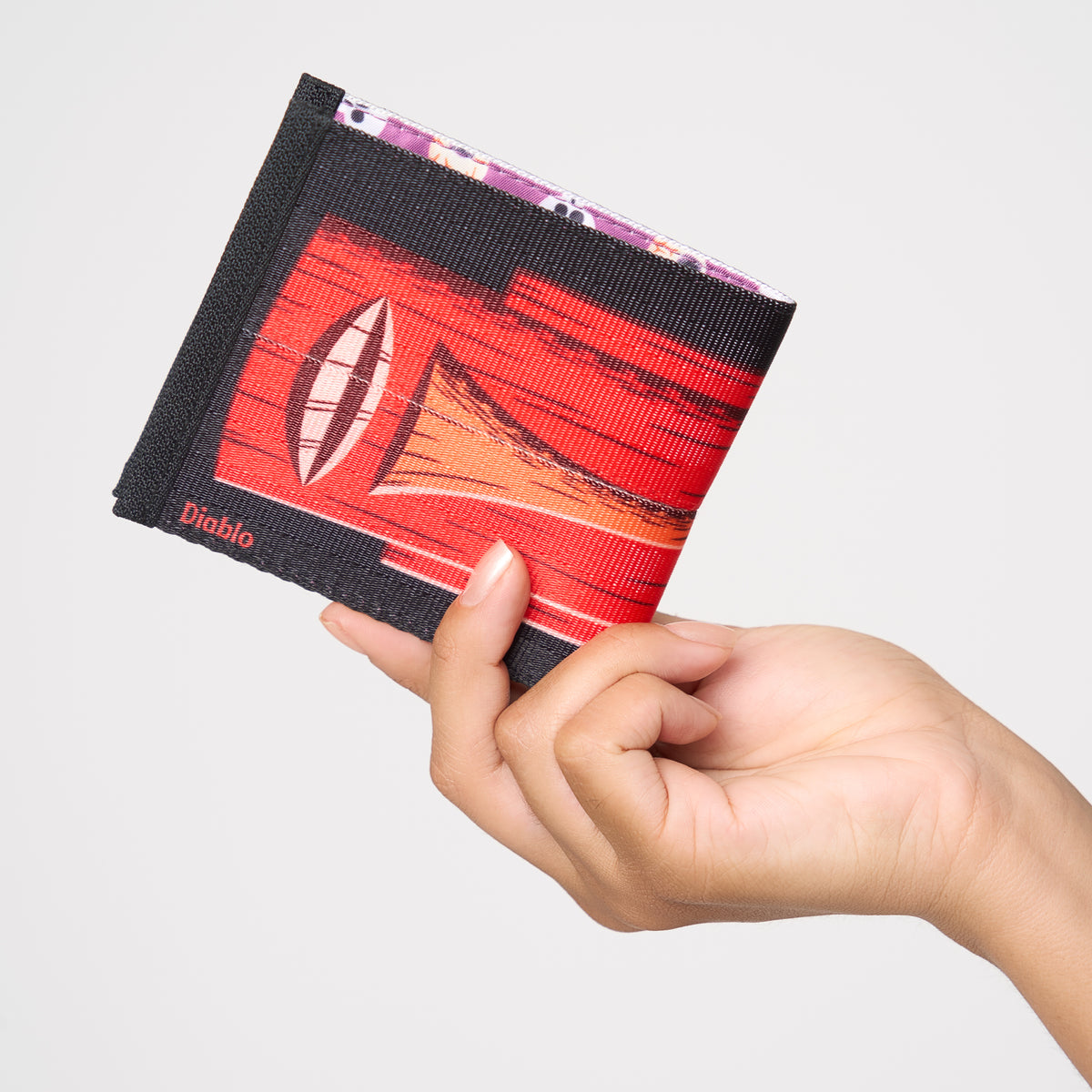 Model holding closed  billfold Shag Diablo