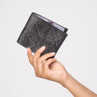 A model holding a Black Widow Billfold
