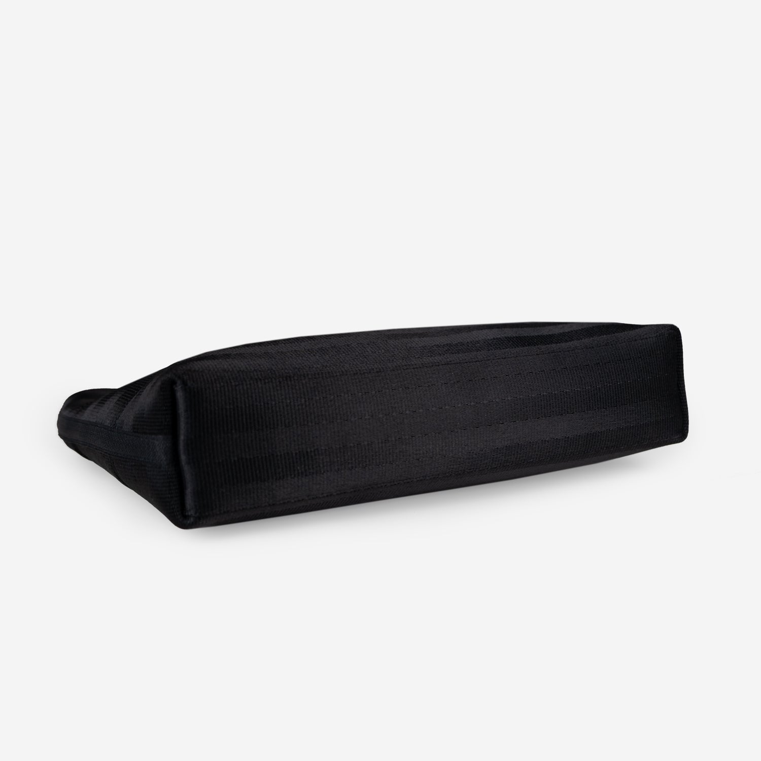 Black makeip pouch on a white background showing bottom of bag