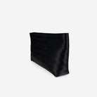 Black makeup case clutch bag on a light gray background