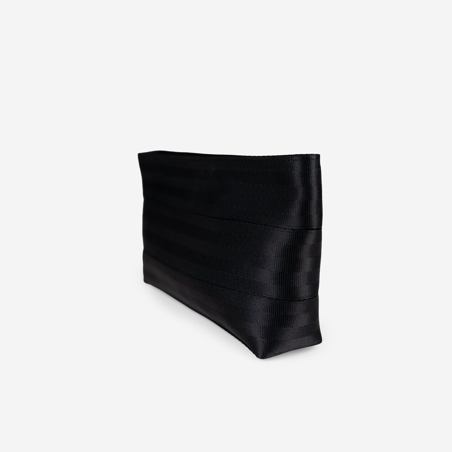 Black makeup case clutch bag on a light gray background