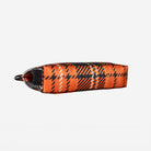 Bottom view of Bow Clutch in orange tartan with adjustable black strap