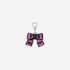 The front view of The Pink Agenda Pink Ribbon Bow Key Charm