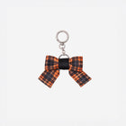 Front view of Bow Key Charm in Orange Tartan