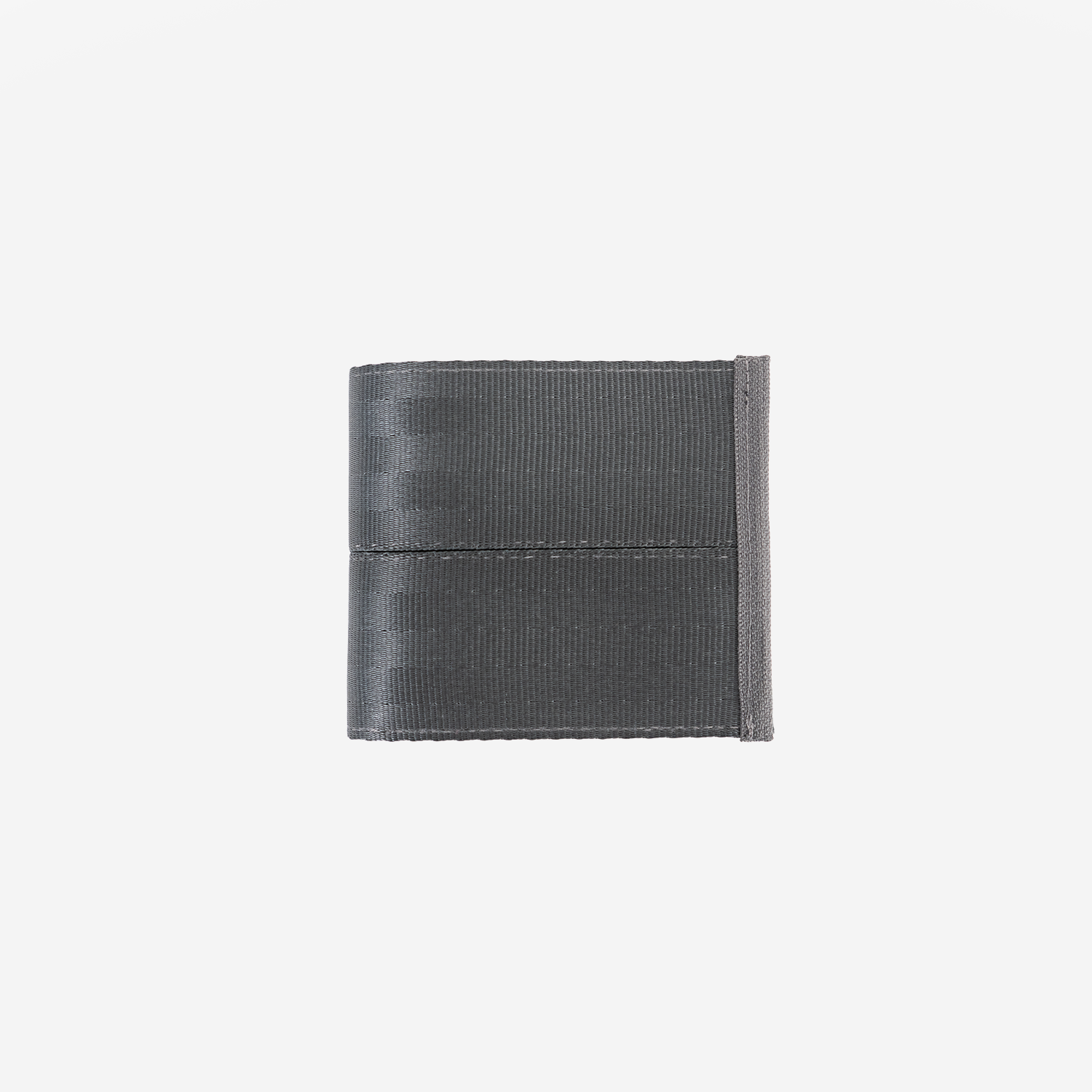 A dark gray billfold wallet made seatbelt, shown closed on a solid light gray background.